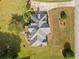 An aerial view showcases the expansive roof and landscaped surroundings of a beautiful property at 180 Butterfield Ln, Fayetteville, GA 30214