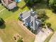 Aerial view showcasing the home's roof, landscaping, driveway, and proximity to a pool at 180 Butterfield Ln, Fayetteville, GA 30214