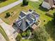 Stunning aerial view of a well-maintained home with landscaped yard, deck, and mature trees surrounding the property at 180 Butterfield Ln, Fayetteville, GA 30214