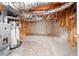 Unfinished basement space with exposed insulation, concrete walls, and a visible HVAC system at 180 Butterfield Ln, Fayetteville, GA 30214
