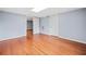 Finished basement with hardwood floors and neutral paint, with two doors at 180 Butterfield Ln, Fayetteville, GA 30214