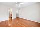 Bedroom featuring hardwood floors, closet, and ensuite bathroom at 180 Butterfield Ln, Fayetteville, GA 30214