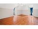 Bedroom with hardwood floors, ceiling fan, and two large windows at 180 Butterfield Ln, Fayetteville, GA 30214