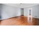 Spacious bedroom with hardwood floors and a ceiling fan at 180 Butterfield Ln, Fayetteville, GA 30214