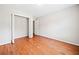 Neutral bedroom featuring hardwood floors and closet at 180 Butterfield Ln, Fayetteville, GA 30214