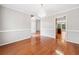 Elegant dining room with hardwood floors, chandelier lighting, and classic white trim at 180 Butterfield Ln, Fayetteville, GA 30214