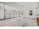 Spacious two-car garage with ample storage space, windows for natural light, and clean concrete flooring at 180 Butterfield Ln, Fayetteville, GA 30214