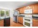 Well-lit kitchen featuring stainless steel appliances and hardwood floors at 180 Butterfield Ln, Fayetteville, GA 30214