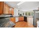 Spacious kitchen featuring stainless steel appliances, a granite countertop, and ample cabinet space at 180 Butterfield Ln, Fayetteville, GA 30214