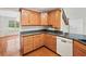 Spacious kitchen featuring wood cabinets, hardwood floors and granite countertops at 180 Butterfield Ln, Fayetteville, GA 30214