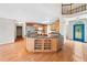 Kitchen island with granite countertop and wood cabinets at 180 Butterfield Ln, Fayetteville, GA 30214