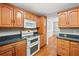 Beautiful kitchen featuring wood cabinets, stainless steel appliances, and granite countertops at 180 Butterfield Ln, Fayetteville, GA 30214