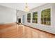 Spacious living room with hardwood floors, fireplace, and large windows offering ample natural light and backyard views at 180 Butterfield Ln, Fayetteville, GA 30214