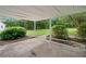 Back patio with brick trim and luscious greenery at 180 Butterfield Ln, Fayetteville, GA 30214