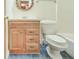 Bathroom featuring a wooden vanity with blue tile floors and modern fixtures at 2211 Jonathan Ave, Lithonia, GA 30058