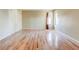 Large bedroom with natural hardwood floors, light walls, and well-lit windows at 2211 Jonathan Ave, Lithonia, GA 30058