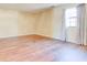 Bedroom featuring wood floors and a window with light-blocking curtains at 2211 Jonathan Ave, Lithonia, GA 30058