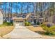 Charming single-story home featuring a one-car garage and a well-maintained front yard landscape at 2211 Jonathan Ave, Lithonia, GA 30058