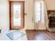Beautiful foyer featuring hardwood floors, a decorative door, and natural light from a window at 2211 Jonathan Ave, Lithonia, GA 30058