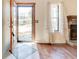 Inviting foyer with a decorative rug, gleaming hardwood floors, and a glimpse of the outdoors at 2211 Jonathan Ave, Lithonia, GA 30058