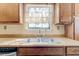 Kitchen sink with a window, wooden countertops, and cabinets at 2211 Jonathan Ave, Lithonia, GA 30058