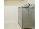 Laundry room with stackable washer and dryer on a hexagonal tile floor at 2211 Jonathan Ave, Lithonia, GA 30058