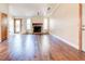 Bright living room with hardwood floors, a stone fireplace, and natural light streaming in at 2211 Jonathan Ave, Lithonia, GA 30058