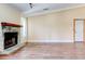 Spacious living area with hardwood flooring, stone fireplace, and neutral wall color at 2211 Jonathan Ave, Lithonia, GA 30058