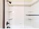 Shower featuring a glass enclosure, and updated faucet and shower head at 2211 Jonathan Ave, Lithonia, GA 30058