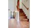 Wooden staircase with hardwood floors, leading to the upper level of the home at 2211 Jonathan Ave, Lithonia, GA 30058