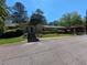 The building has covered parking, manicured landscaping, and a welcoming entrance at 395 Russell Sw Dr, Smyrna, GA 30082