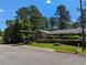 The front entrance of this building features a covered entry and manicured landscaping at 395 Russell Sw Dr, Smyrna, GA 30082