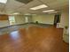This open-concept interior has ample natural light and versatile flooring for a variety of uses at 395 Russell Sw Dr, Smyrna, GA 30082