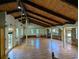Bright and spacious living room with light hardwood floors, vaulted wood ceilings, and stone wall feature at 395 Russell Sw Dr, Smyrna, GA 30082