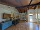 A well-lit living room boasting hardwood floors, vaulted wood ceilings, and a granite counter beverage center at 395 Russell Sw Dr, Smyrna, GA 30082