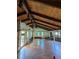 Expansive living room featuring vaulted wood ceilings, hardwood floors, and many windows allowing ample natural light at 395 Russell Sw Dr, Smyrna, GA 30082