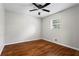 Cozy bedroom featuring hardwood floors and a ceiling fan at 624 Lyle Se Dr, Marietta, GA 30067