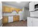Kitchen features yellow cabinetry, granite counters, subway tile backsplash, and stainless appliances at 624 Lyle Se Dr, Marietta, GA 30067