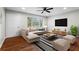 Bright living room featuring hardwood floors, a large window, and stylish furnishings at 624 Lyle Se Dr, Marietta, GA 30067