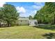 Large backyard features a deck with seating, providing ample space for outdoor activities and relaxation at 1007 Wayne Dr, Snellville, GA 30078