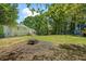 Spacious backyard featuring a fire pit area and plenty of room for outdoor enjoyment and entertaining at 1007 Wayne Dr, Snellville, GA 30078