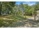 Expansive backyard showcasing a play area with a trampoline and swing set, creating a fun outdoor space at 1007 Wayne Dr, Snellville, GA 30078