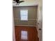 Cozy bedroom featuring hardwood floors, neutral walls, a window, and white trim at 1007 Wayne Dr, Snellville, GA 30078
