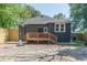 Back exterior of home showing deck, basketball hoop, and new wooden fence at 1967 West John Calvin Ave, Atlanta, GA 30337