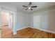 Bedroom featuring hardwood floors, neutral walls and white trim at 1967 West John Calvin Ave, Atlanta, GA 30337