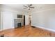 Bedroom features hardwood floors, a fireplace, and a closet at 1967 West John Calvin Ave, Atlanta, GA 30337