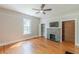 Bedroom featuring hardwood floors, a fireplace, and a closet at 1967 West John Calvin Ave, Atlanta, GA 30337