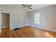 Bedroom with hardwood floors, featuring a ceiling fan and a window at 1967 West John Calvin Ave, Atlanta, GA 30337