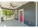 Inviting front porch with ceiling fan and red door at 1967 West John Calvin Ave, Atlanta, GA 30337