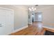 Hallway leading into living room, with hardwood floors and neutral wall colors at 1967 West John Calvin Ave, Atlanta, GA 30337